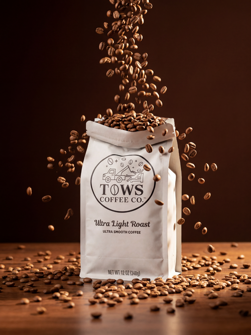 TOWS Coffee Co. bag with coffee beans spilling out on a wooden surface