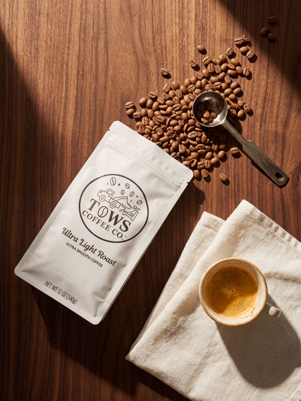 Coffee package with coffee beans and a cup on a wooden surface
